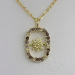 Colgante Muka Plata Dorada y Circonitas Marrones
